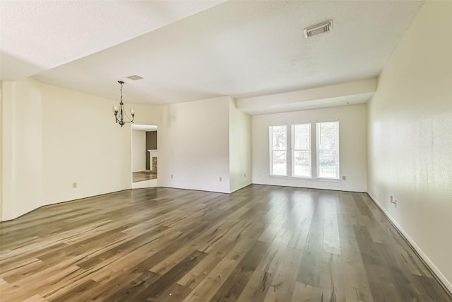 16002 Maple Acres Ct, Houston, TX 77095 - unfurnished living room with a chandelier and wood finished floors