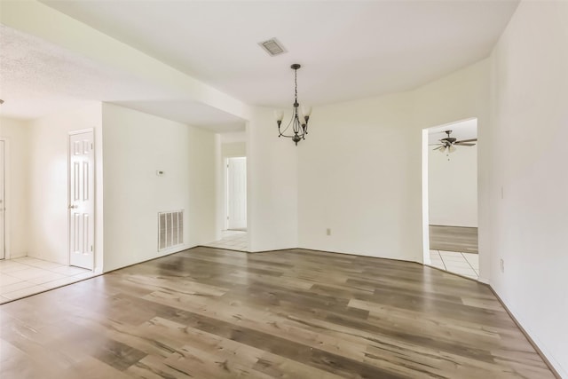 16002 Maple Acres Ct, Houston, TX 77095 - empty room featuring a chandelier, wood finished floors, and ceiling fan