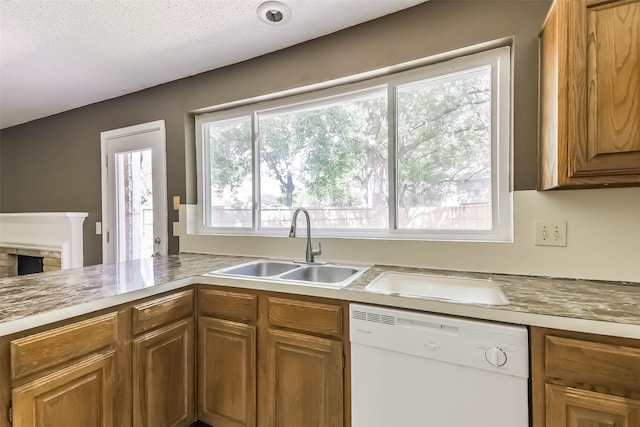 16002 Maple Acres Ct, Houston, TX 77095 - kitchen featuring dishwasher, brown cabinetry, and light countertops