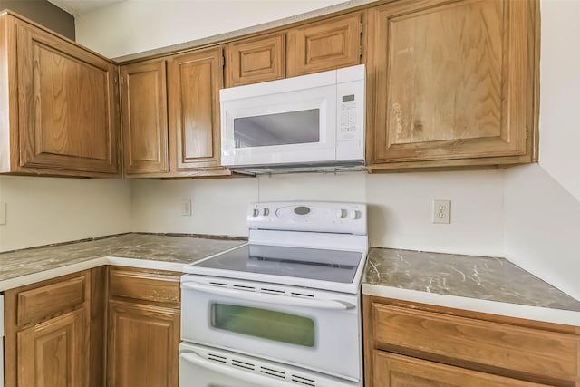 16002 Maple Acres Ct, Houston, TX 77095 - kitchen featuring white appliances and brown cabinetry