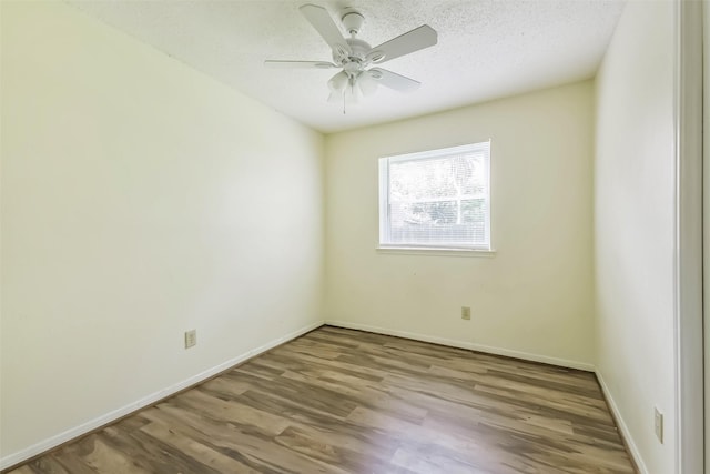 16002 Maple Acres Ct, Houston, TX 77095 - spare room featuring wood finished floors, a ceiling fan, and a textured ceiling