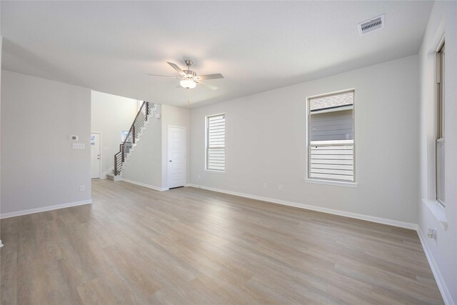 spare room with ceiling fan and light hardwood / wood-style floors