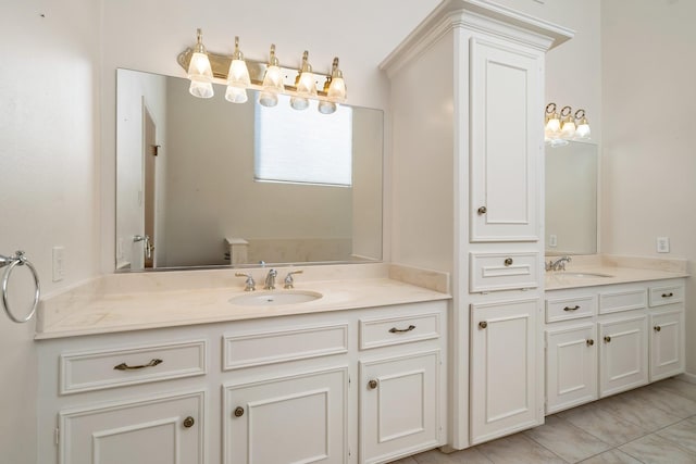 bathroom with tile patterned flooring and vanity