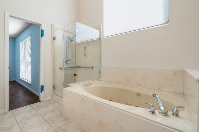 bathroom featuring tile patterned floors and plus walk in shower