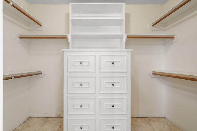 walk in closet featuring light tile patterned floors