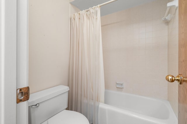 bathroom with shower / bathtub combination with curtain and toilet