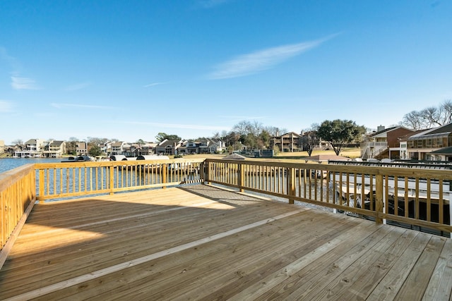 wooden terrace with a water view