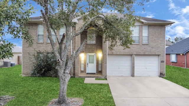 view of front of property featuring a front yard and a garage