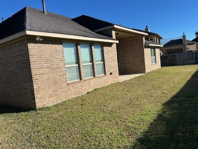 view of home's exterior featuring a lawn