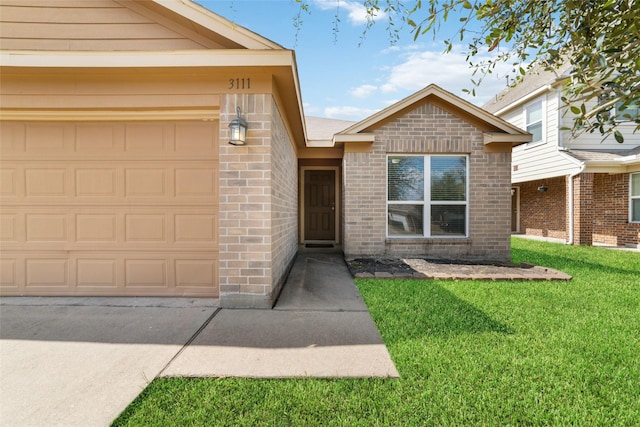 view of exterior entry with a yard and a garage