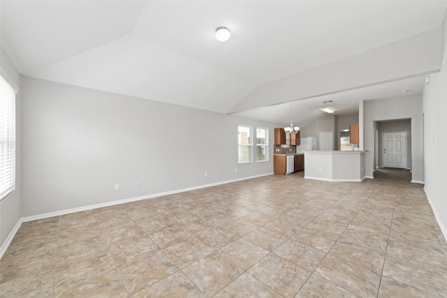 unfurnished living room with a notable chandelier and lofted ceiling