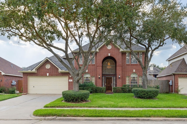 view of front of home featuring a garage and a front yard