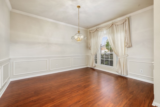 unfurnished room featuring an inviting chandelier, ornamental molding, and dark hardwood / wood-style flooring