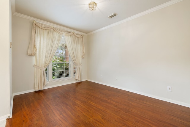 unfurnished room featuring ornamental molding and hardwood / wood-style floors