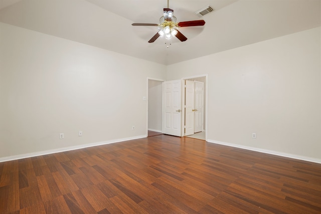 empty room featuring ceiling fan and dark wood-type flooring