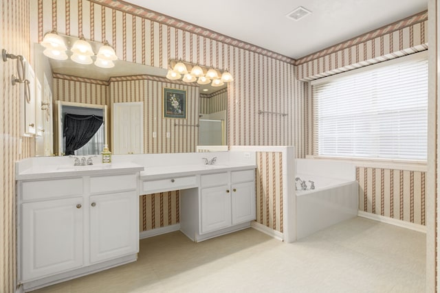 bathroom with vanity and a bathing tub