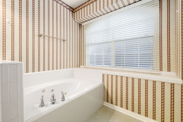 bathroom with a tub to relax in