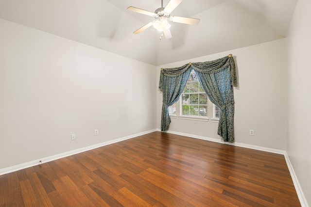 spare room with ceiling fan, lofted ceiling, and dark hardwood / wood-style floors