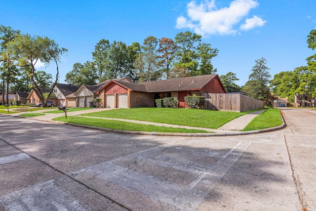 ranch-style house with a front yard and a garage