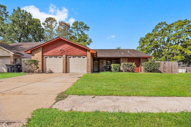 ranch-style home with a front lawn and a garage