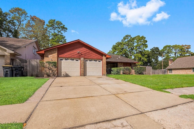 view of front of house with a garage and a front yard