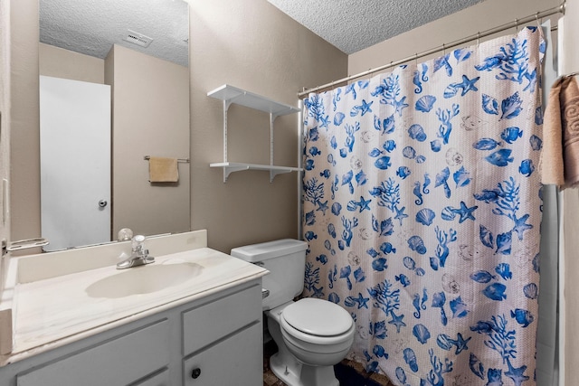 bathroom featuring toilet, a textured ceiling, a shower with shower curtain, and vanity