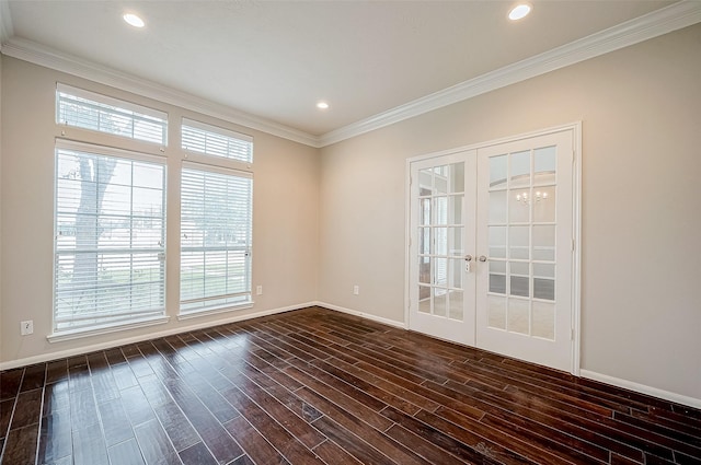 empty room featuring french doors, dark hardwood / wood-style flooring, plenty of natural light, and crown molding