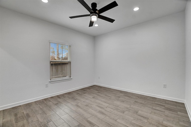 unfurnished room featuring ceiling fan and light hardwood / wood-style floors