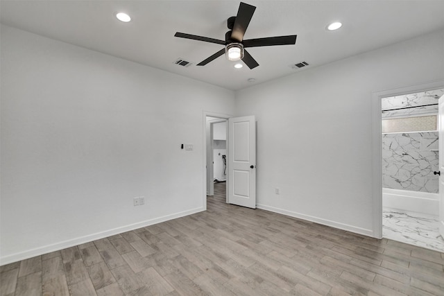 unfurnished bedroom featuring ceiling fan and light hardwood / wood-style floors