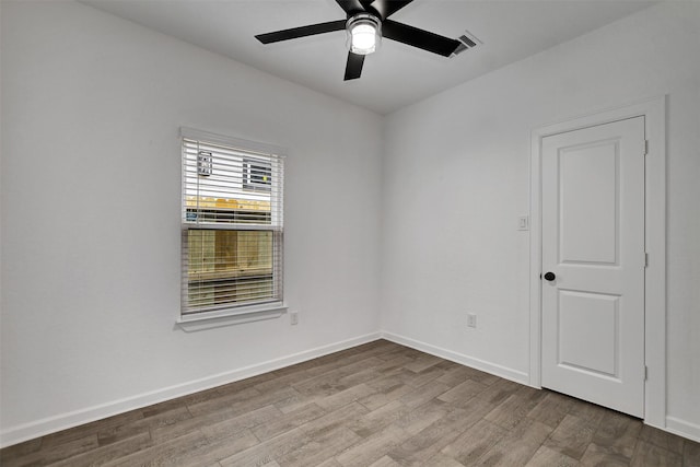 unfurnished room featuring hardwood / wood-style floors and ceiling fan