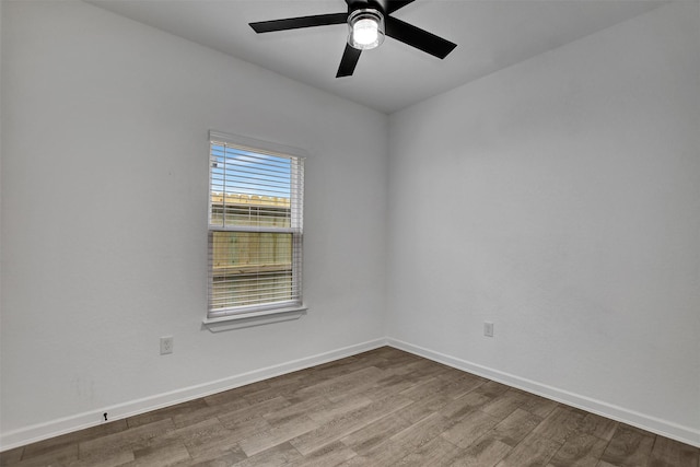 empty room featuring ceiling fan and wood-type flooring