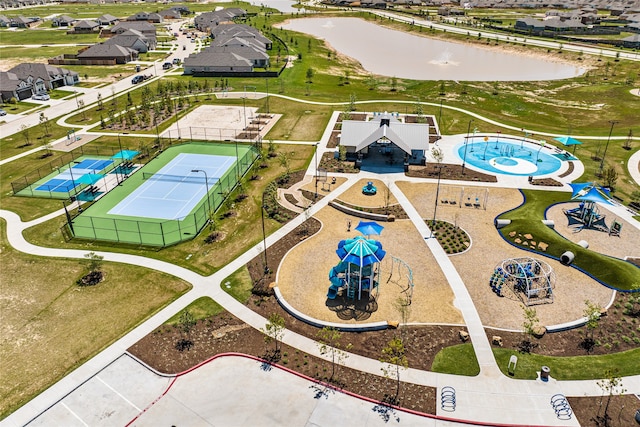 birds eye view of property with a water view