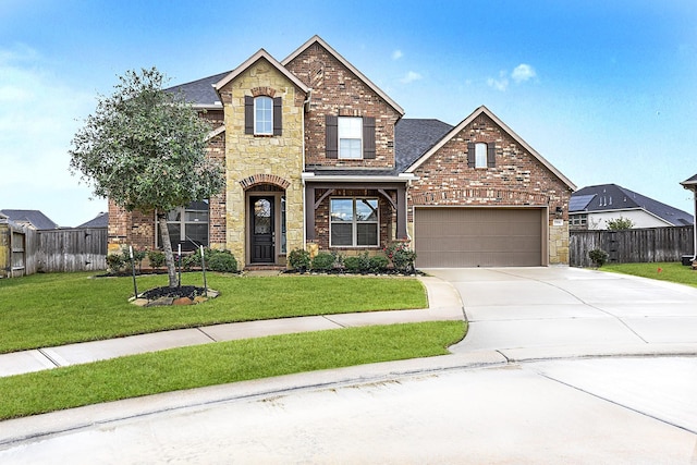 view of front of house featuring a garage and a front yard