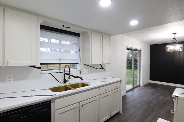 kitchen featuring dishwasher, white cabinets, pendant lighting, dark wood-type flooring, and sink