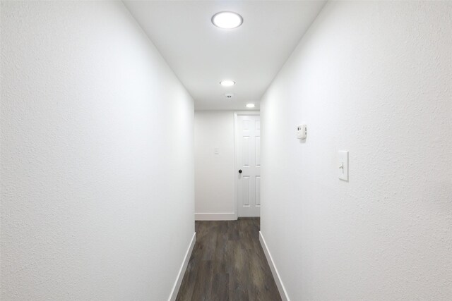 hallway featuring dark hardwood / wood-style flooring