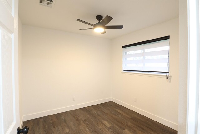 unfurnished room featuring dark hardwood / wood-style flooring and ceiling fan