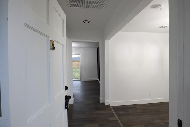 hall with dark hardwood / wood-style flooring