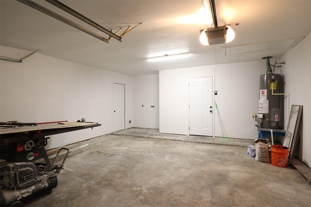 garage with water heater and a garage door opener