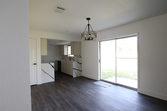 interior space featuring sink, a chandelier, hanging light fixtures, and dark hardwood / wood-style floors