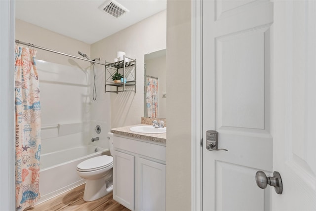 full bath with toilet, wood finished floors, vanity, visible vents, and shower / bath combo with shower curtain