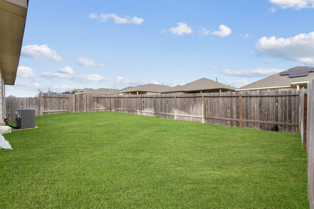 view of yard with central AC