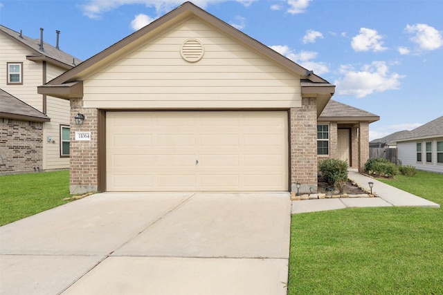 view of front of property with a front lawn and a garage