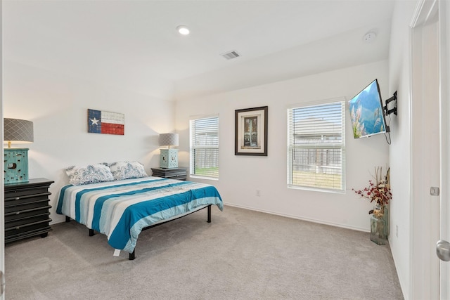 bedroom with light carpet