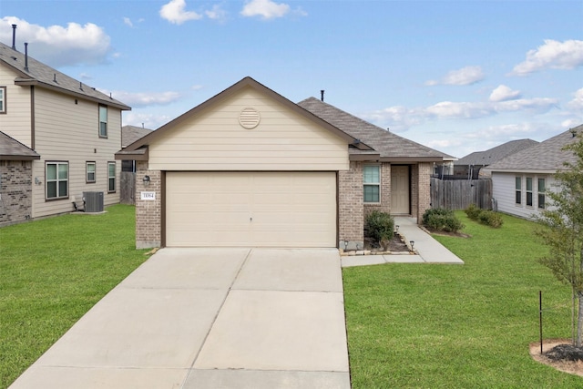 view of front of property featuring central AC unit, a garage, and a front lawn