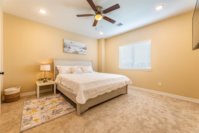 carpeted bedroom with ceiling fan