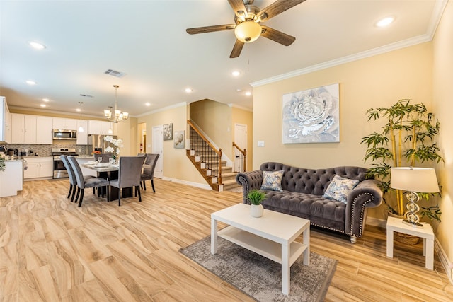 living room with ceiling fan with notable chandelier, ornamental molding, and light hardwood / wood-style flooring