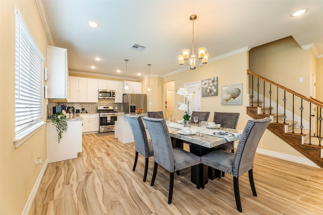 dining space featuring ornamental molding and a chandelier