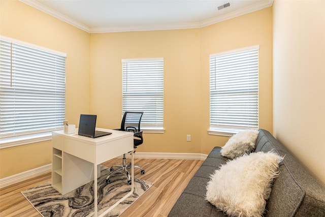 office with ornamental molding and hardwood / wood-style flooring