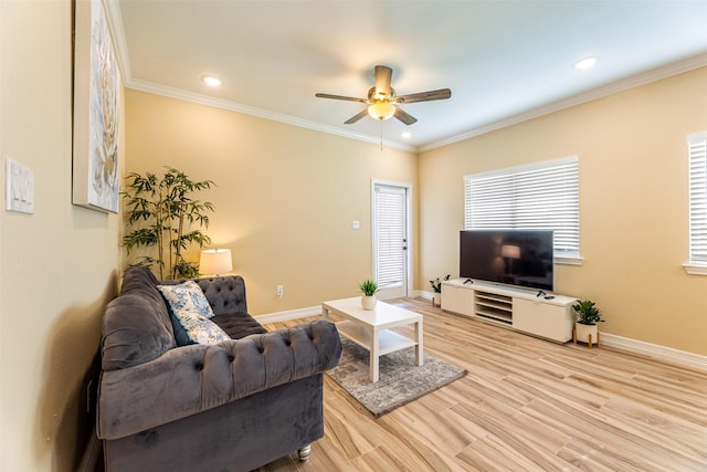 living room with ceiling fan, ornamental molding, and light hardwood / wood-style floors