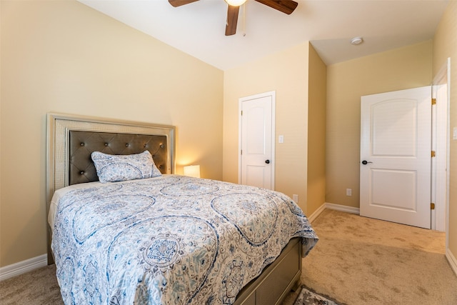 bedroom with ceiling fan and light colored carpet